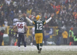 Green Bay Packers quarterback Aaron Rodgers reacts after throwing a touchdown pass to Jordy Nelson during the second half of an NFL football game against the Houston Texans Sunday, Dec. 4, 2016, in Green Bay, Wis. (AP Photo/Matt Ludtke)